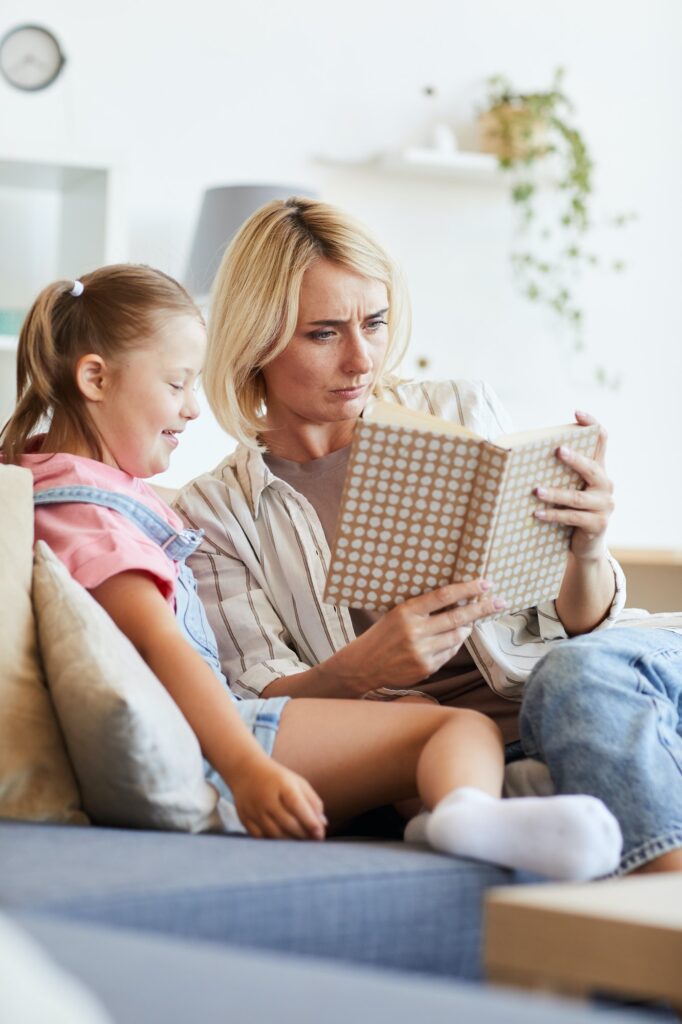 woman-reading-a-book-to-girl-682x1024